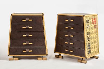 two wooden chests with drawers on each side of them
