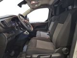 a view of the inside of a truck from the driver ' s seat