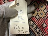 a person holding a piece of paper with a price tag on it