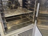 an open oven with a fan inside of it