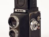 an old camera that is sitting on a table