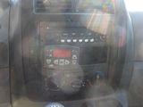 a picture of a car dashboard with the sun shining through the window