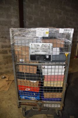 a metal cart with a bunch of boxes on it