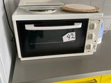 a microwave sitting on top of a counter in a kitchen
