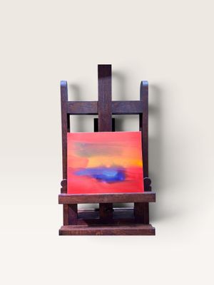 un chevalet sur lequel est posé un tableau, posé sur une surface blanche