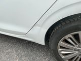 a white car parked on the side of the road