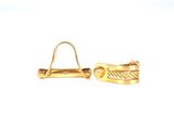 paire de boucles d'oreilles manchette plaquées or au motif torsadé