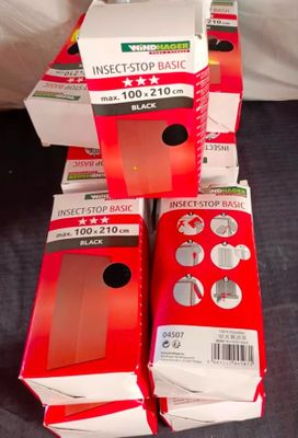 several boxes of insect traps are stacked on top of each other