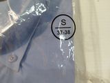 a blue shirt wrapped in plastic on a table