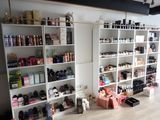 a room with a lot of shelves and bottles on it
