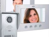 a picture of a video door phone with a picture of a man and a woman