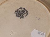 a white plate with a black and white design on it
