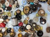 many different types of buttons on a table