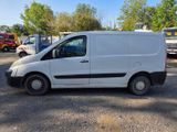 a white van that is parked in a parking lot