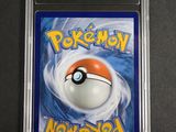 a close up of a pokemon card in a plastic case