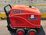 a red machine that is sitting on the ground
