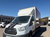 a white van that is parked in a parking lot