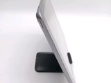 a close up view of a cell phone on a stand