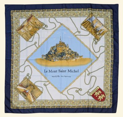 a blue and white scarf with a picture of a castle on it