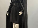 an image of a mannequin dressed in a black cape and dress