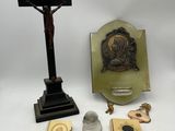 several religious items including a crucif, a cross, a book, and a rosary