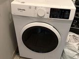 a washer and dryer in a small room