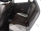 the back seats of a white car with a black seat belt