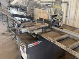 an image of a machine that is working on a piece of wood