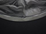 a black and white photo of a bowl with a cloth in it