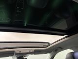 a view of the sunroof from inside of a car