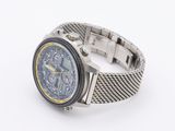a close up of a watch on a white surface with a white background