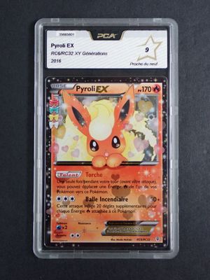 a close up of a pokemon card on a black surface