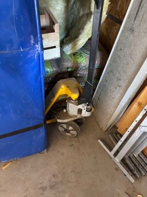 a picture of a blue refrigerator in a garage