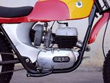 a red and yellow motorcycle parked on the side of the road