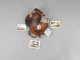 a baseball mitt with pictures of people on it on a table