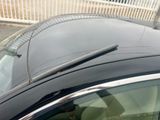 a black car with a windshield wiper on top of it