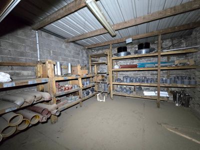 a room that has a lot of shelves in it