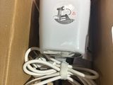 a box with a charger inside of it on a table