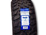 a close up of a tire on a white background with a blue label