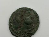 a close up of a coin on a white surface
