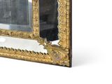 a gold frame with a mirror on it on a white surface