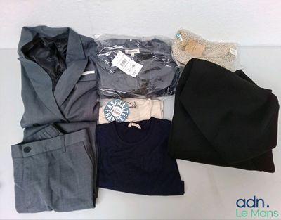 a pile of clothing that is sitting on a table