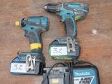 three cordless drillers on a wooden table