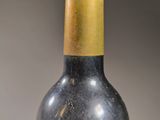 a bottle of wine that is sitting on a table
