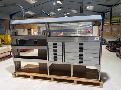 a metal cabinet with drawers and drawers on a pallet in a warehouse
