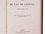 an old book opened to show the title of a novel