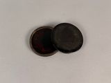 two buttons that are sitting on a white surface