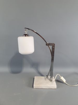 an image of a lamp that is on top of a table