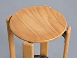 a wooden stool with a metal ring around it