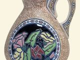 a ceramic vase with a floral design on it